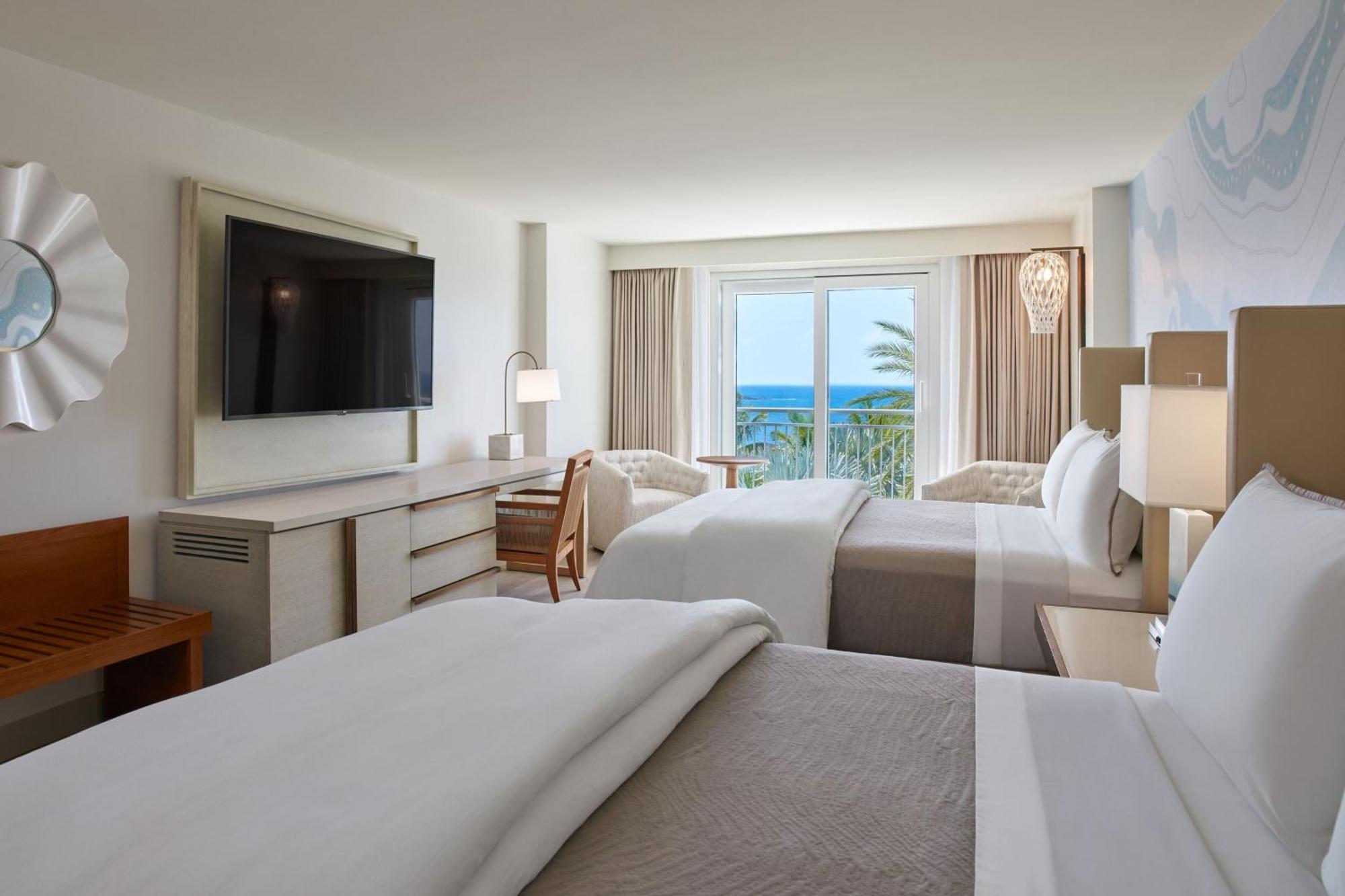 Queen Room Two Queen Beds Roll Shower Partial Ocean View